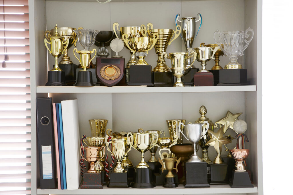 group,of,trophy,displayed,on,the,shelf